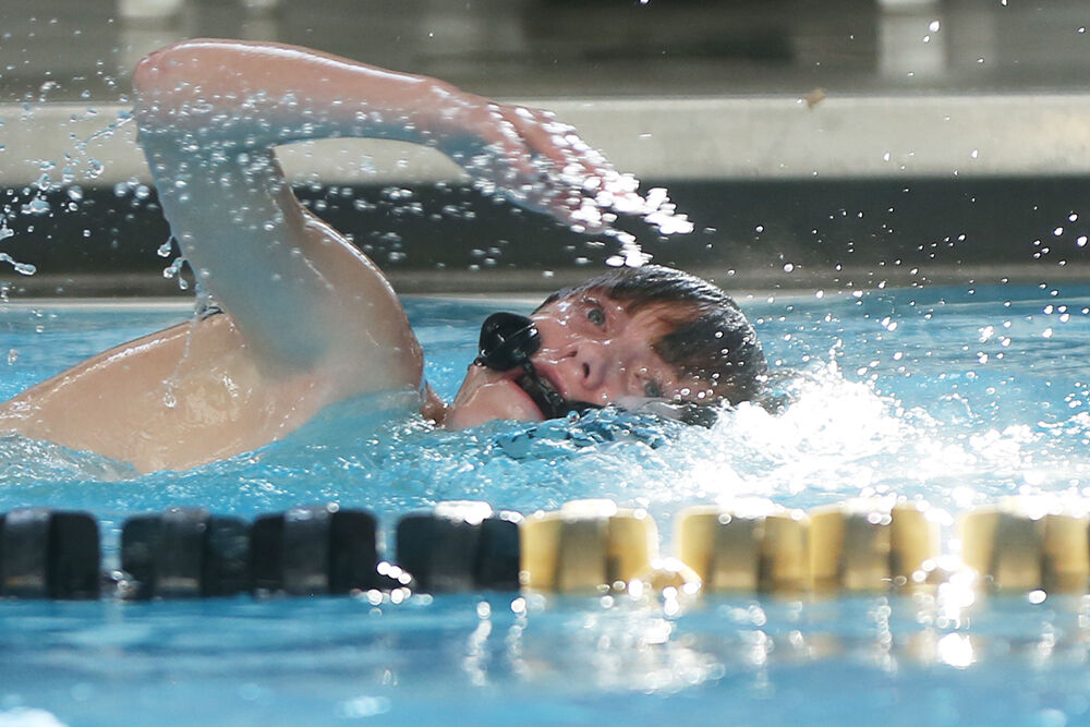 Logan Jordahl takes this first breath during the 100-yard freestyle race